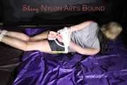 Pia being tied and gagged on a sofa with ropes and a cloth gag wearing a sexy shiny nylon shirts and a tshirt (Pics)