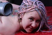 Florence tied hogtied to a pole