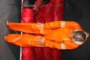 Watching Pia putting on a wonderful supersexy shiny nylon rainssuit in orange (Pics)