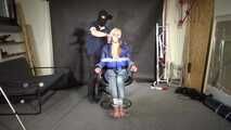 Alice bound and gagged in a shiny nylon Downjacket