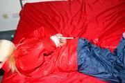 Nina tied and gagged in shiny nylon rainwear