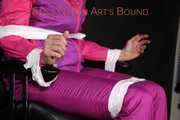 Watching Pia being tied and gagged with tapes and a clothgag on a hairdresser chair from Sophie wearing a sexy pink downwear combination (Pics)