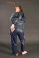 Alina posing in a studio wearing a supersexy darkblue rainwear combination (Pics)