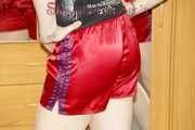Mara putting on several shiny nylon shorts and posing infront of the camera (Pics)