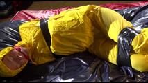 Sonja tied, gagged and hooded on bed with tape wearing a supersexy yellow rainwear combination (Video)