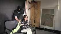 Marie bound and gagged in a shiny nylon Downjacket