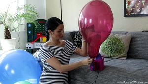 Angie is pumping up some balloons and pop them