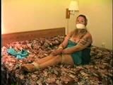 BBW MICHELLE IS WRAP VET TAPE GAGGED, CLEAVE GAGGED, BAREFOOT, TOE-TIED & BOUND UP ON THE BED (D47-13)