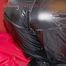 Lucy wearing a very hot black rainwear combination lolling and posing on a sofa (Pics)