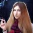 Mysterious girl Valya poses on camera with a tasty 120mm cigarette