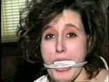 24 YEAR OLD ERICA IS MOUTH STUFFED, CLEAVE GAGGED, ROPE GAGGED & BALL-TIED WITH BLACK ELECTRICAL TAPE ON THE FLOOR (D51-16)