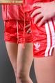 Blonde archive girl posing infront of a mirror wearing sexy red shiny nylon shorts and a red rain jacket (Pics)
