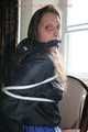 Stella being tied and gagged with ropes and a clothgag on a chair wearing a sexy shiny nylon short and a rain jacket (Pics)