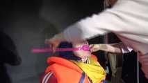 Watching Jill wearing a sexy shiny nylon rain pants and three shiny nylon rain jackets and a life jacket being tied and gagged and HOODED three times (Video)