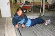 Stella tied and gagged in a garage wearing a shiny rainwear combination (Pics)