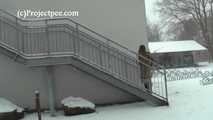 020167 Kathy Pees From A Staircase In The Snow