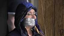 Alice bound and gagged in a shiny nylon Downjacket