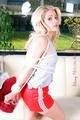 Nina tied and gagged in shiny red nylon shorts