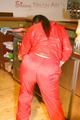 Jill posing sexy in an bar wearing sexy red shiny nylon rainwear (Pics)