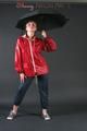 Anastasia posing in a foto studio wearing supersexy rainwear (Pics)