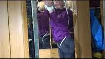 Pia tied with ropes overhead and gagged with a ballgag wearing sexy rain pants and a rain jacket (Video)