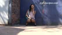 064002 Kima Takes A Shy Pee In Front Of The Warehouse Door