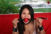 Restrained Asian is Gagged with Huge Ball Gag and Exposed in Humiliating Positions