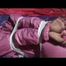 03:50 Min. video with Julia tied and gagged in a shiny pink skisuit