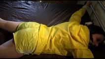 Lucy tied and gagged on a bed wearing a supersexy rarely yellow shiny nylon shorts and a yellow rain jacket (Video)