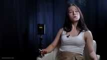Brunette teen is smoking cork 100mm cigarette