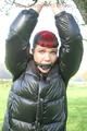 Jill tied and gagged outdoor on a tree wearing a sexy black downjacket and a black rain pants (Pics)