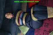 Get 548 Pictures with Jill tied and gagged in shiny nylon rainwear from 2005-2008!