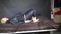 Watching Pia being tied and gagged with ropes and a clothgag wearing sex black shiny nylon suit (Video)