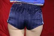 Watching sexy Sonja wearing a supersexy oldschool blue shiny nylon shorts and a lightblue rain jacket during her workout with barbells (Pics)