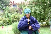 Jill Diamond in the garden playing with water out of the garden hose wearing supersexy shiny nylon rainwear and a rain cape (Pics)