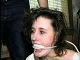24 YEAR OLD ERICA IS MOUTH STUFFED, CLEAVE GAGGED, ROPE GAGGED & BALL-TIED WITH BLACK ELECTRICAL TAPE ON THE FLOOR (D51-16)