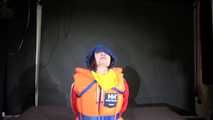 Watching Jill wearing a sexy shiny nylon rain pants and three shiny nylon rain jackets and a life jacket being tied and gagged and HOODED three times (Video)