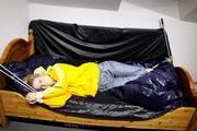 Samanthy bound and gagged in shiny nylon rainwear