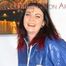 Jill enjoys herself wearing a shiny nylon rainsuit (Pics)