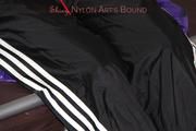 Samantha tied and gagged on bed wearing shiny nylon rainwear (Pics)