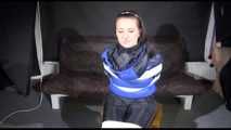 Watching SEXY MARA sitting on a chair being tied and gagged with tape and a clothgag and hood her the other way round (Video)