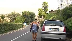 016119 Eve Pees Seated On The Wall Of A Water Channel