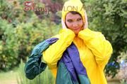 Jill Diamond in the garden playing with water out of the garden hose wearing supersexy shiny nylon rainwear and a rain cape (Pics)