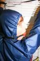 Stella tied, gagged and hooded on an radiator wearing a shiny red/blue rain combination (Pics)