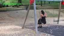 050013 Roxy Sits On A Swing In The Park And Then Pees On The Path