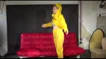 Watching Mara putting on sexy yellow shiny nylon rainwear lolling on the sofa (Video)