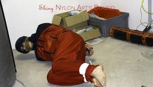 Shelly tied and gagged in shiny nylon rainwear