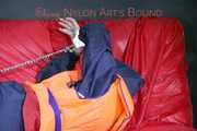 *** HOT HOT HOT*** NEW MODELL*** DESTINY wearing a sexy blue/red shiny nylon rain suit and a life jacket ties and gagges herself with cuffs on a sofa (Pics)