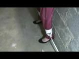 Nicole tied and gagged in a beautiful shiny silver/red PVC suit by Sophie in the cellar (Video)