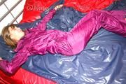 Alina preparing her bed for relaxing and lolling on the bed wearing a sexy shiny nylon rain pants and a rain jacket (Pics)